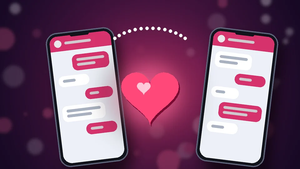 Dos móviles conectados por una línea de puntos con un corazón rosa en el centro, símbolo de la conexión emocional en pareja a través del chat.